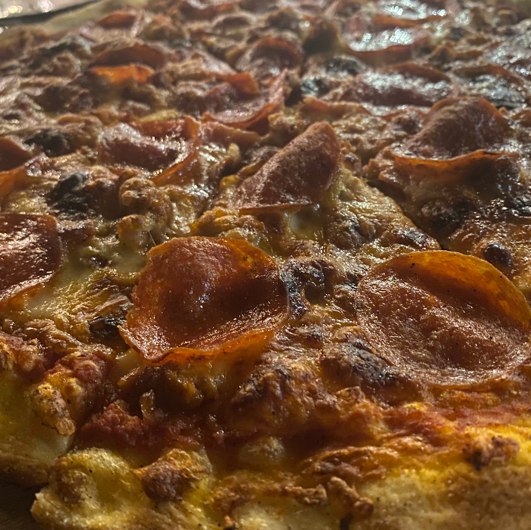 Sauced Pizza: appetizing close-up of pizza