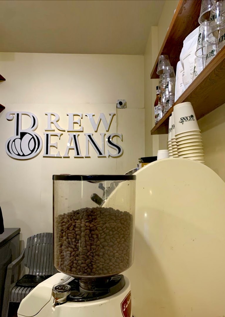 Brew Beans Coffee Bar: clear branding and coffee equipment