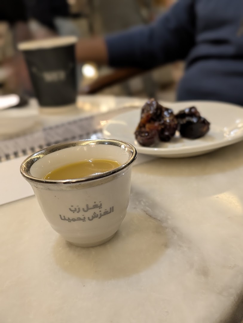 Mara Coffee: appetizing photo of coffee and dates