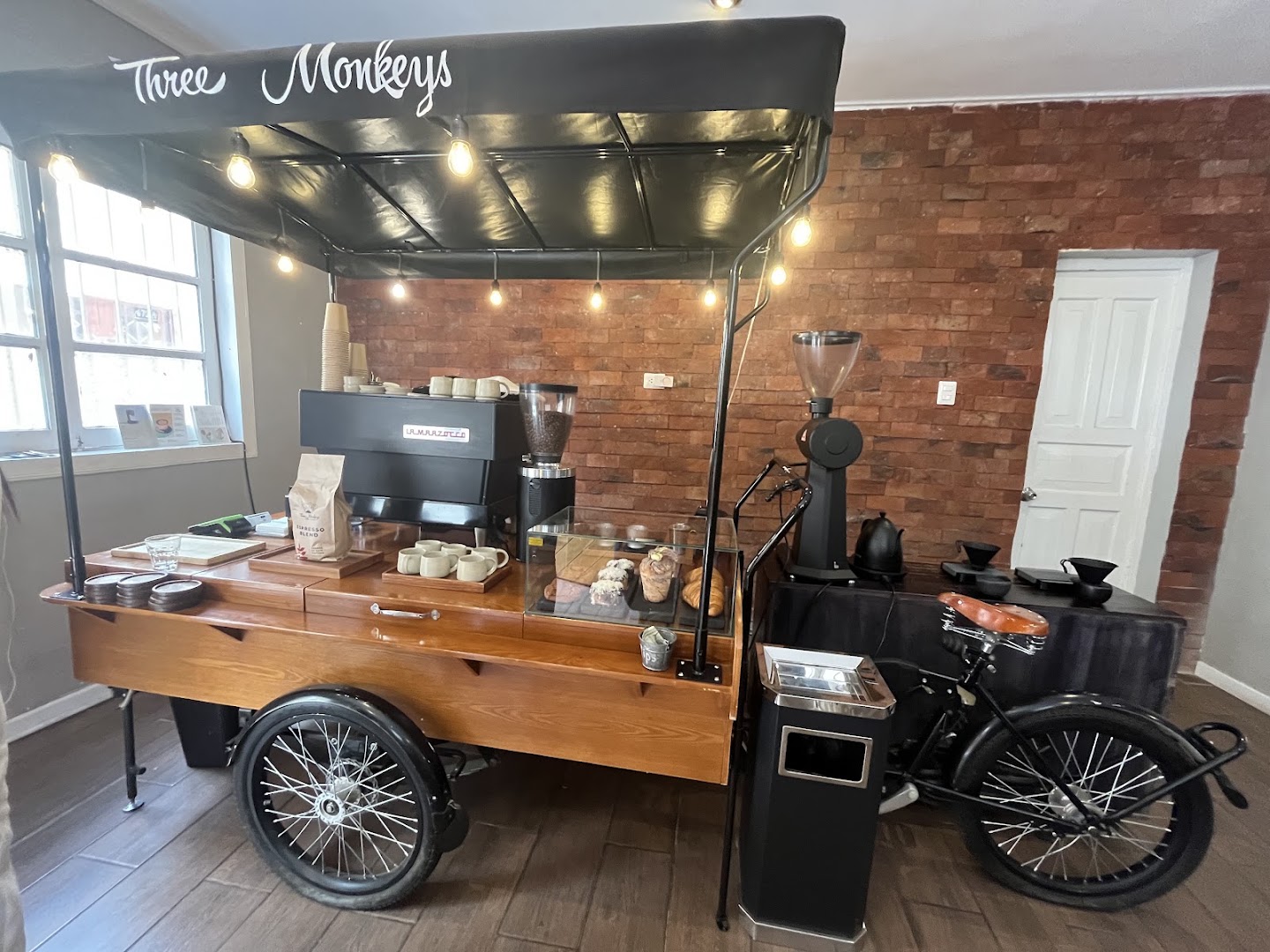 Three Monkeys Coffee: attractive coffee cart interior shot