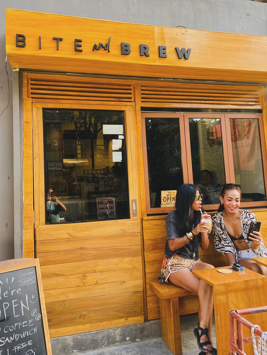 Bite and Brew Cafe: inviting atmosphere with happy customers