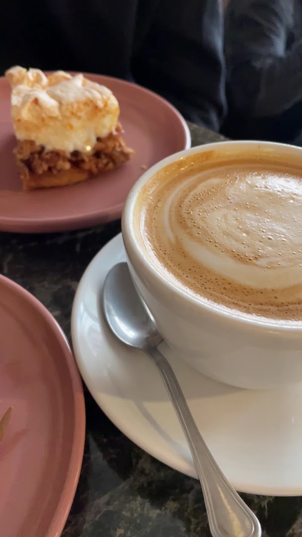 Central Coffee Perks: appetizing coffee and pastry photo