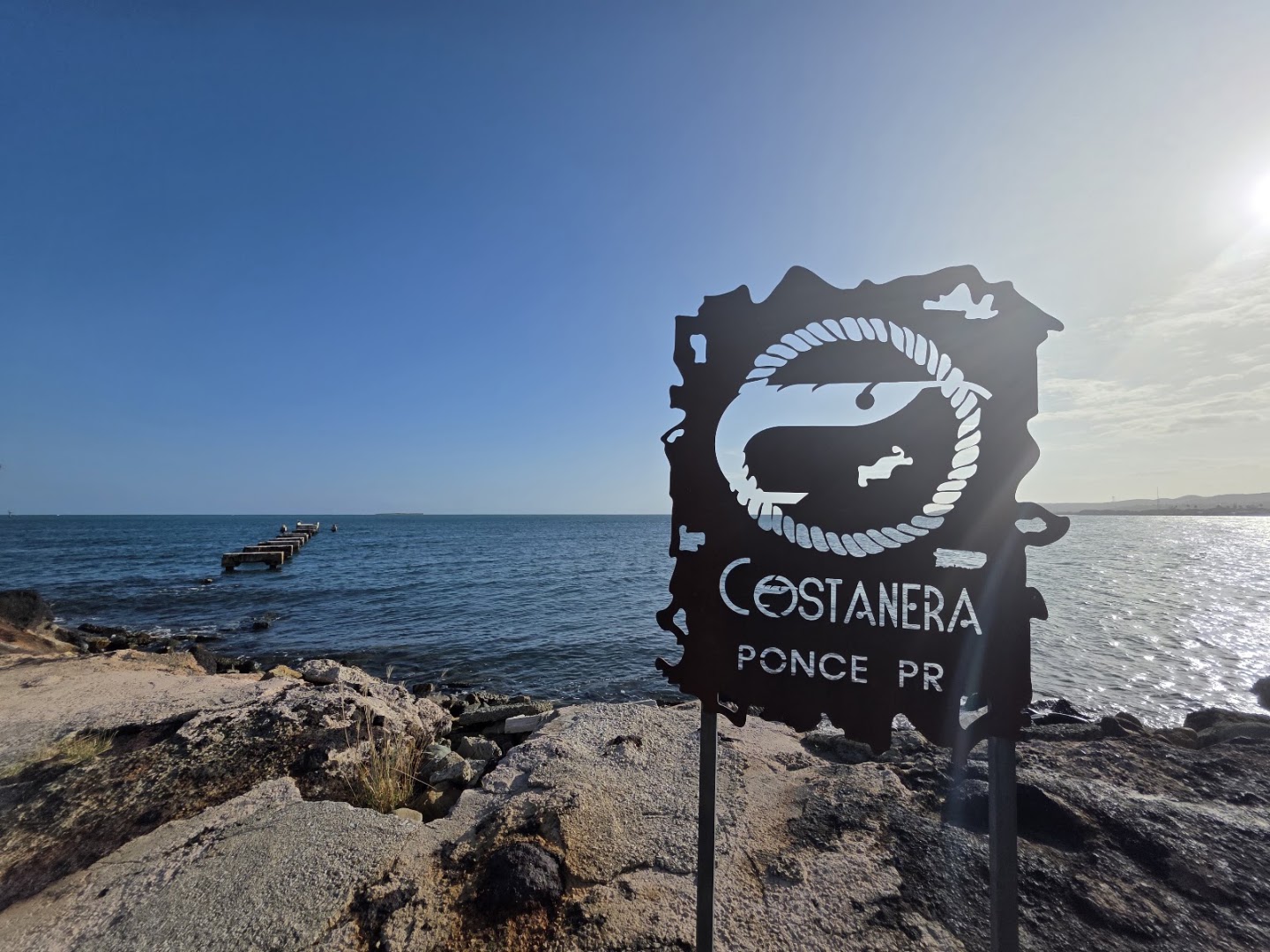 Costanera by Sazón: attractive signage and scenic view