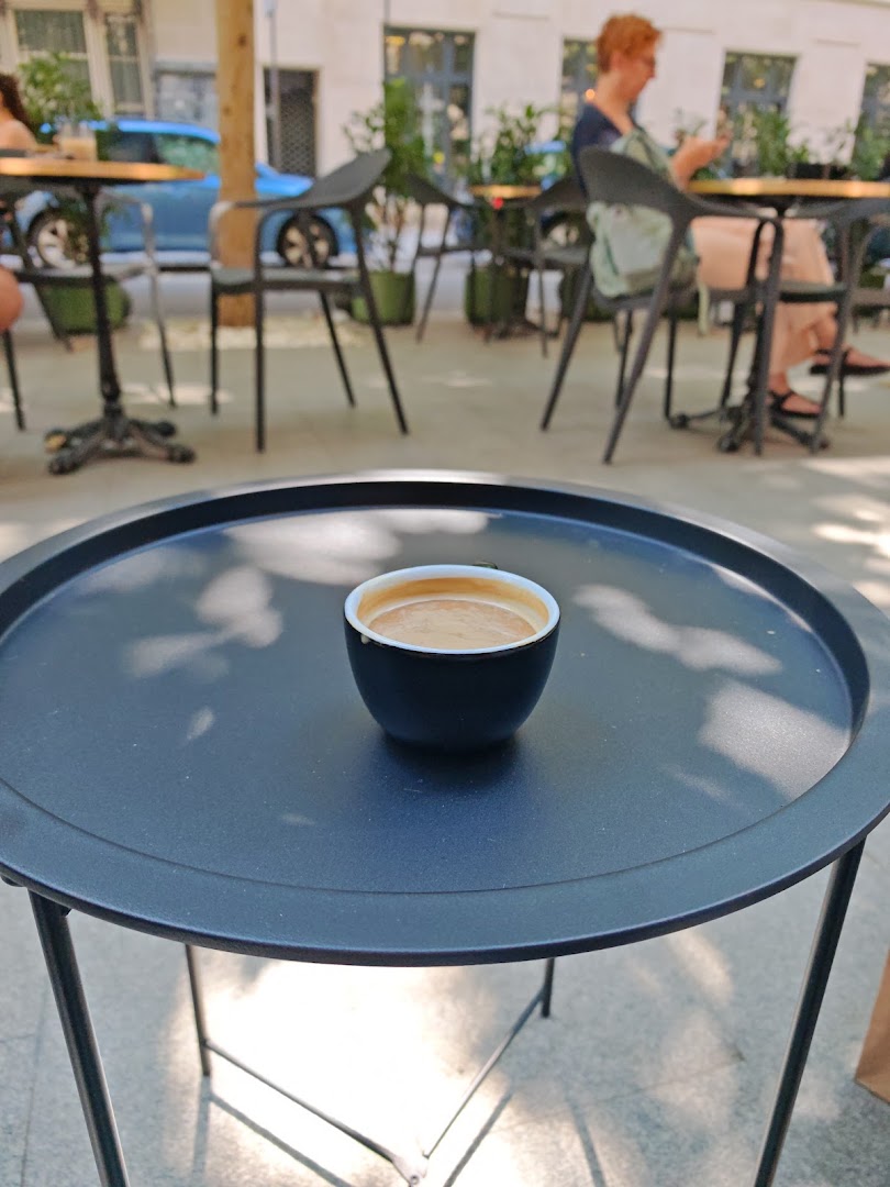 NF Café: appealing shot of coffee outdoors