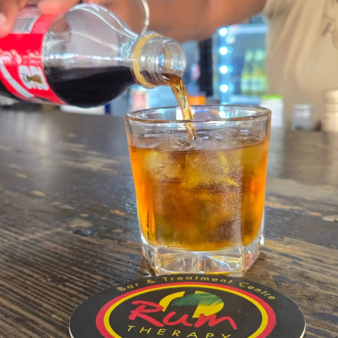 Rum Therapy Bar: appealing drink pour action shot