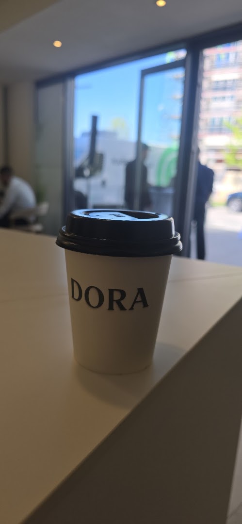 Dora: clear branded coffee cup photo