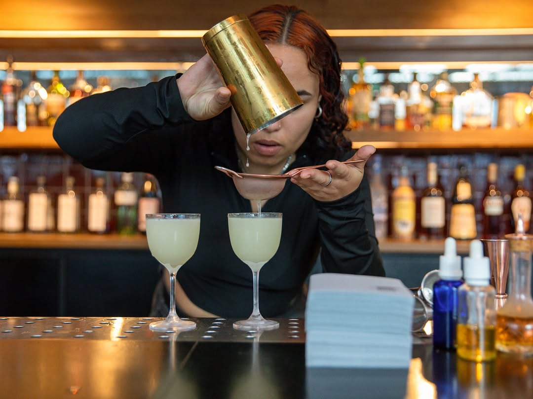Unclaimed Bar: professional shot of drink preparation