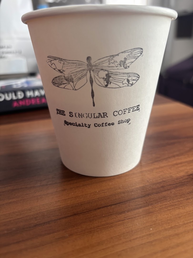 The Singular Coffee: clear branding on coffee cup