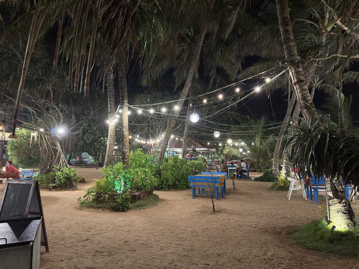 The Wave Beach Restaurant: inviting evening atmosphere and setting