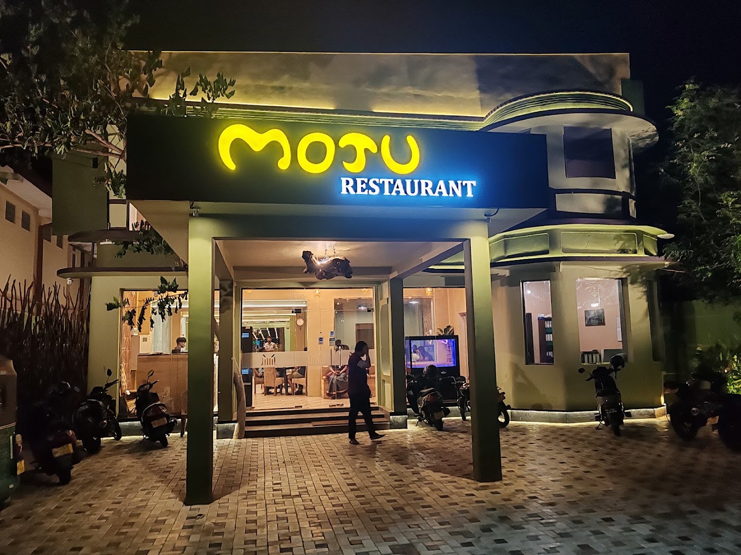 Moju Restaurant Jaffna: clear, professional exterior night shot