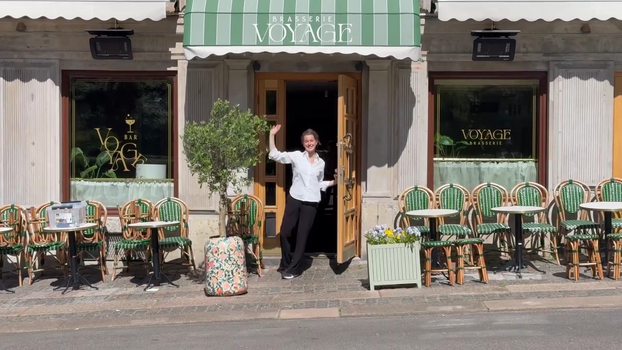 Brasserie Voyage: inviting exterior with staff member