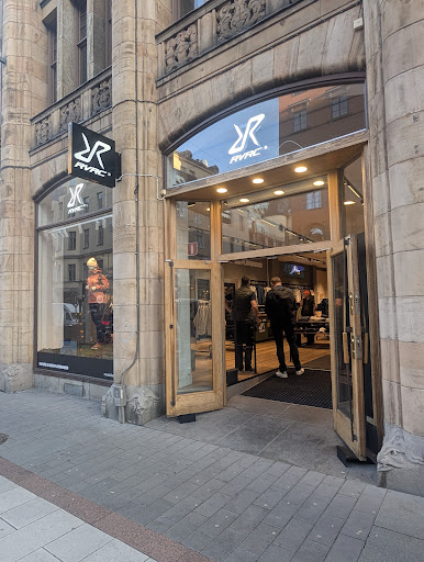 RevolutionRace Brand Store: clear storefront photo of shop