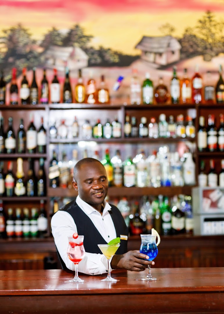 Barafu - The Bar: professional photo of bartender serving