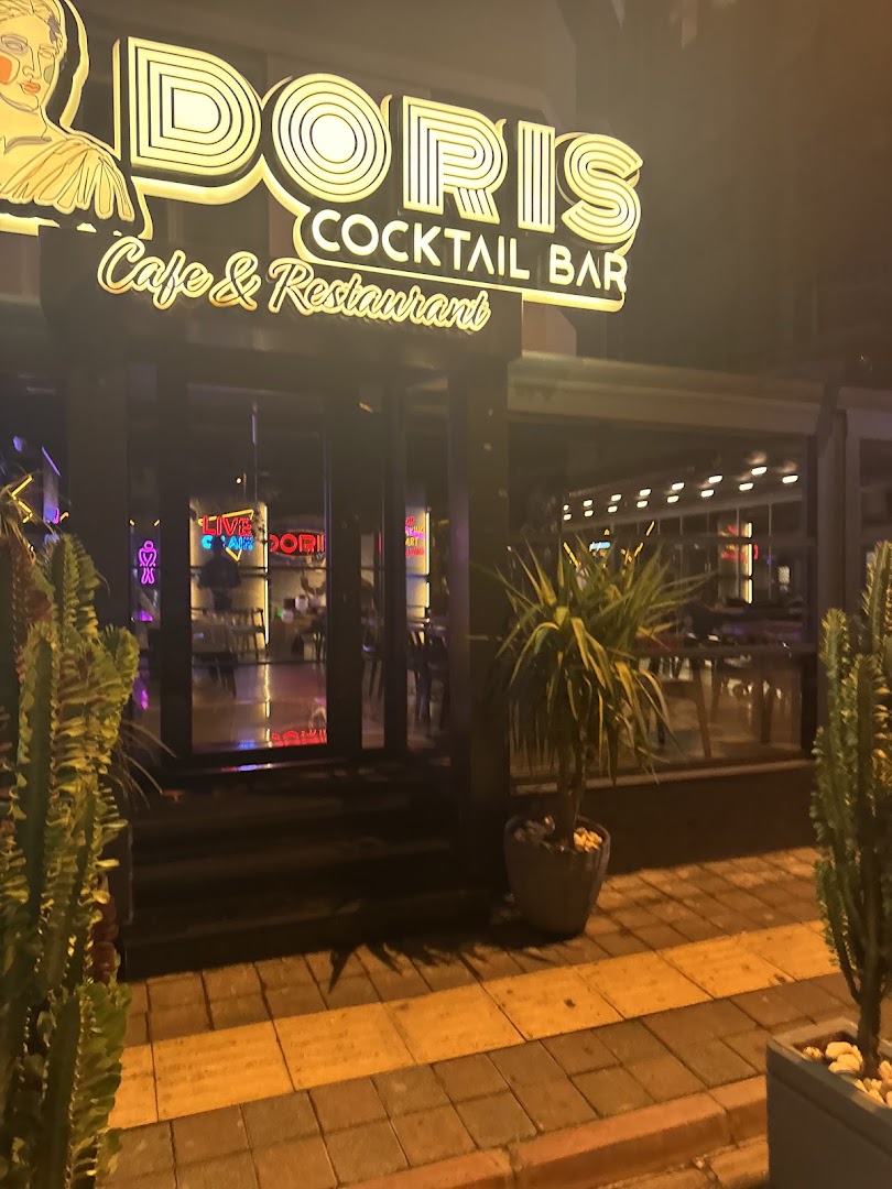 Doris Cocktail Bar: clear, inviting exterior night shot