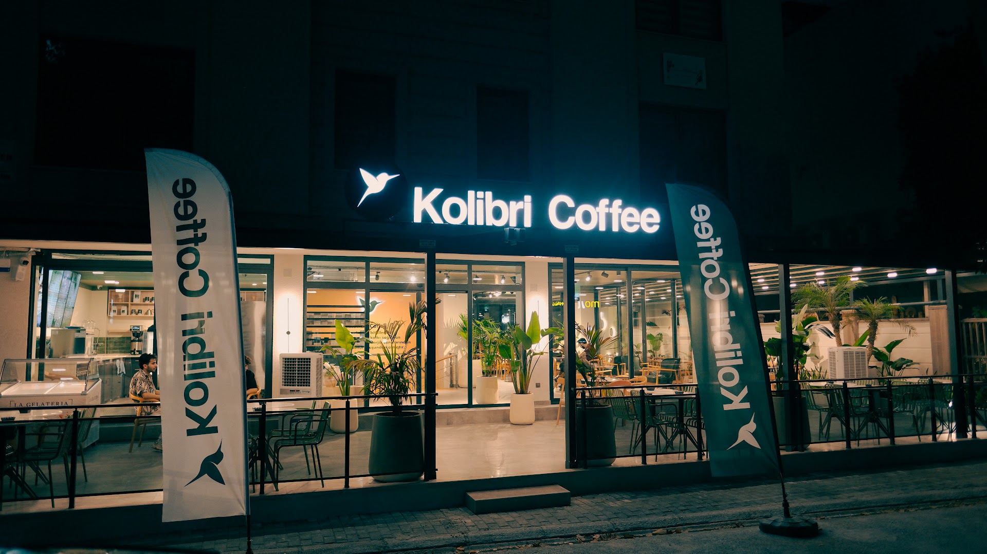 Kolibri Coffee - Gazipaşa: clear, inviting exterior night shot