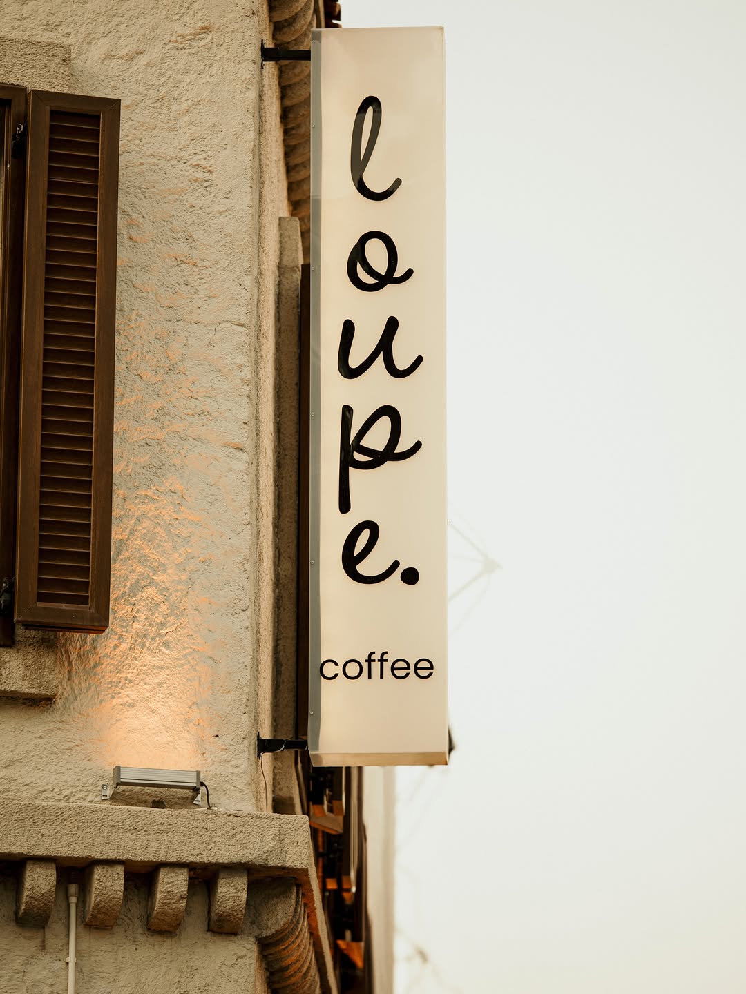 Loupe Coffee: clear professional signage photo