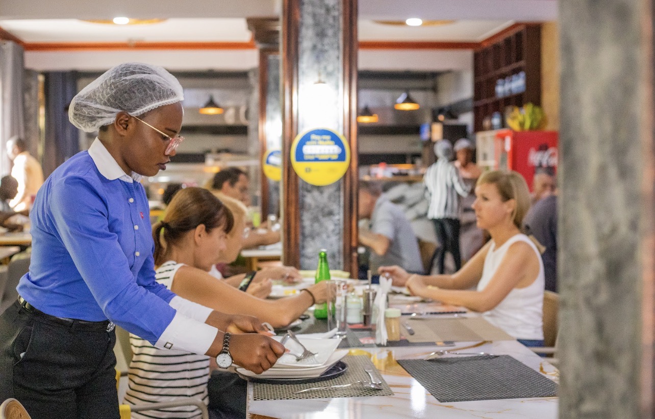 T. Will's Hotel: professional photo showing staff service