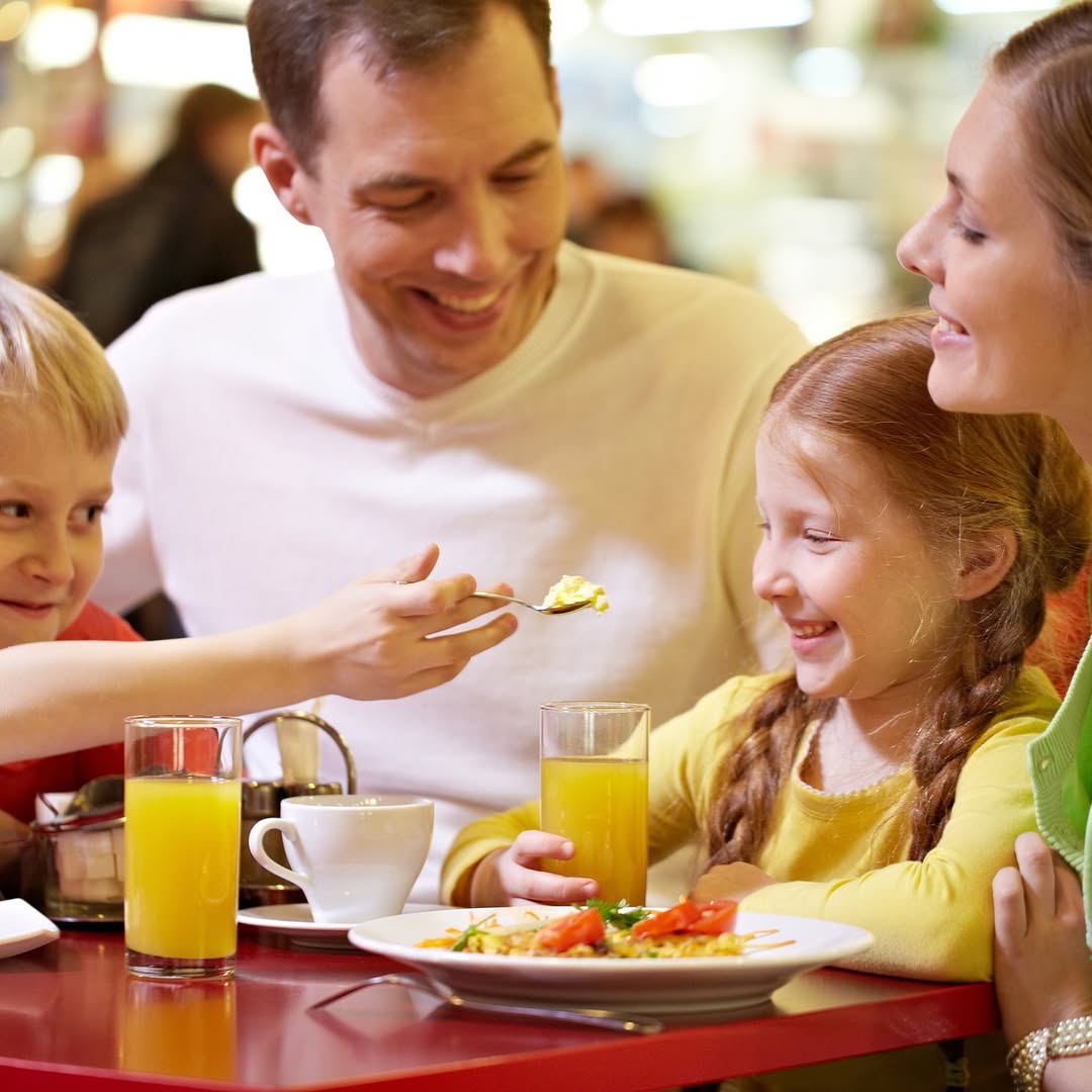 Frisky Fox: happy family enjoying restaurant meal