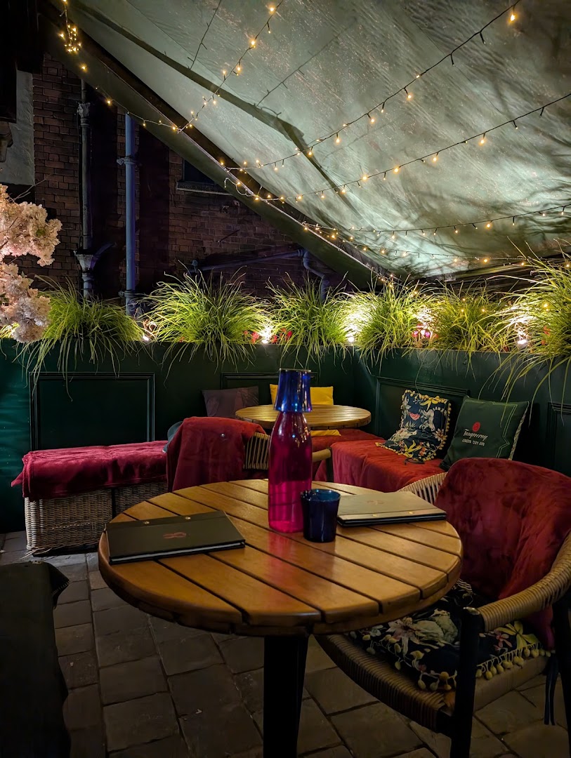 Angel & Two Bibles: inviting and atmospheric terrace shot