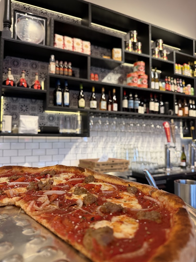 Pedroso's Pizza: appetizing pizza with restaurant background