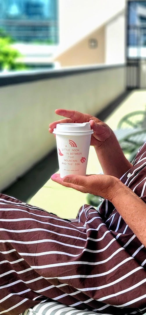 Blanc Nook Cafe: inviting atmosphere with branded cup