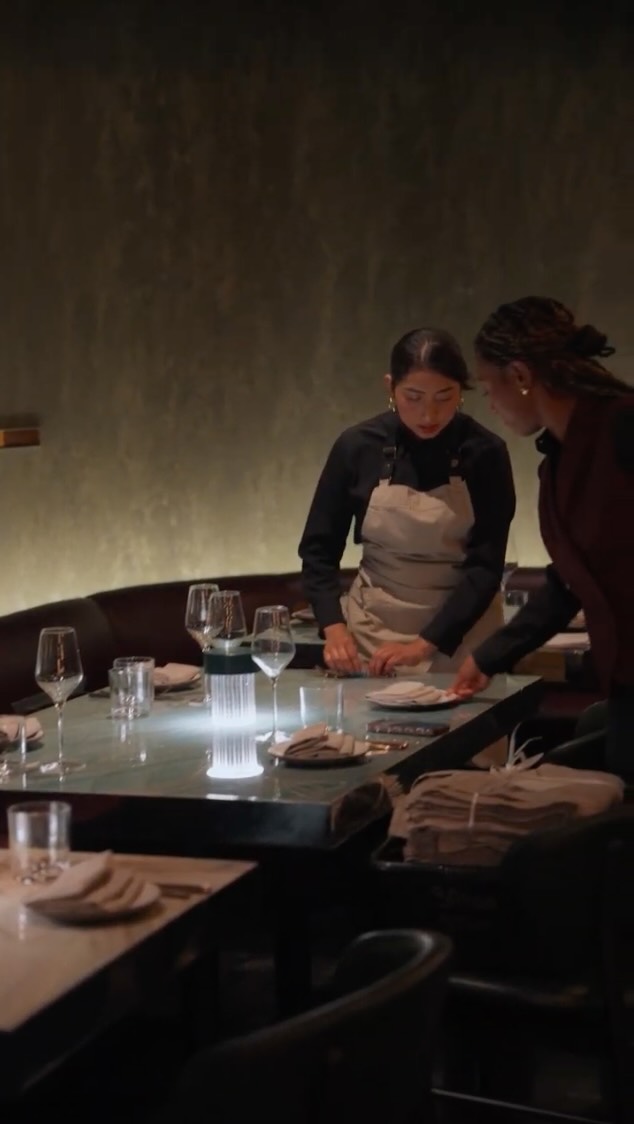 Maroon: professional staff setting the table