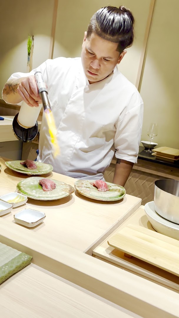Yasu Omakase: professional chef preparing omakase sushi