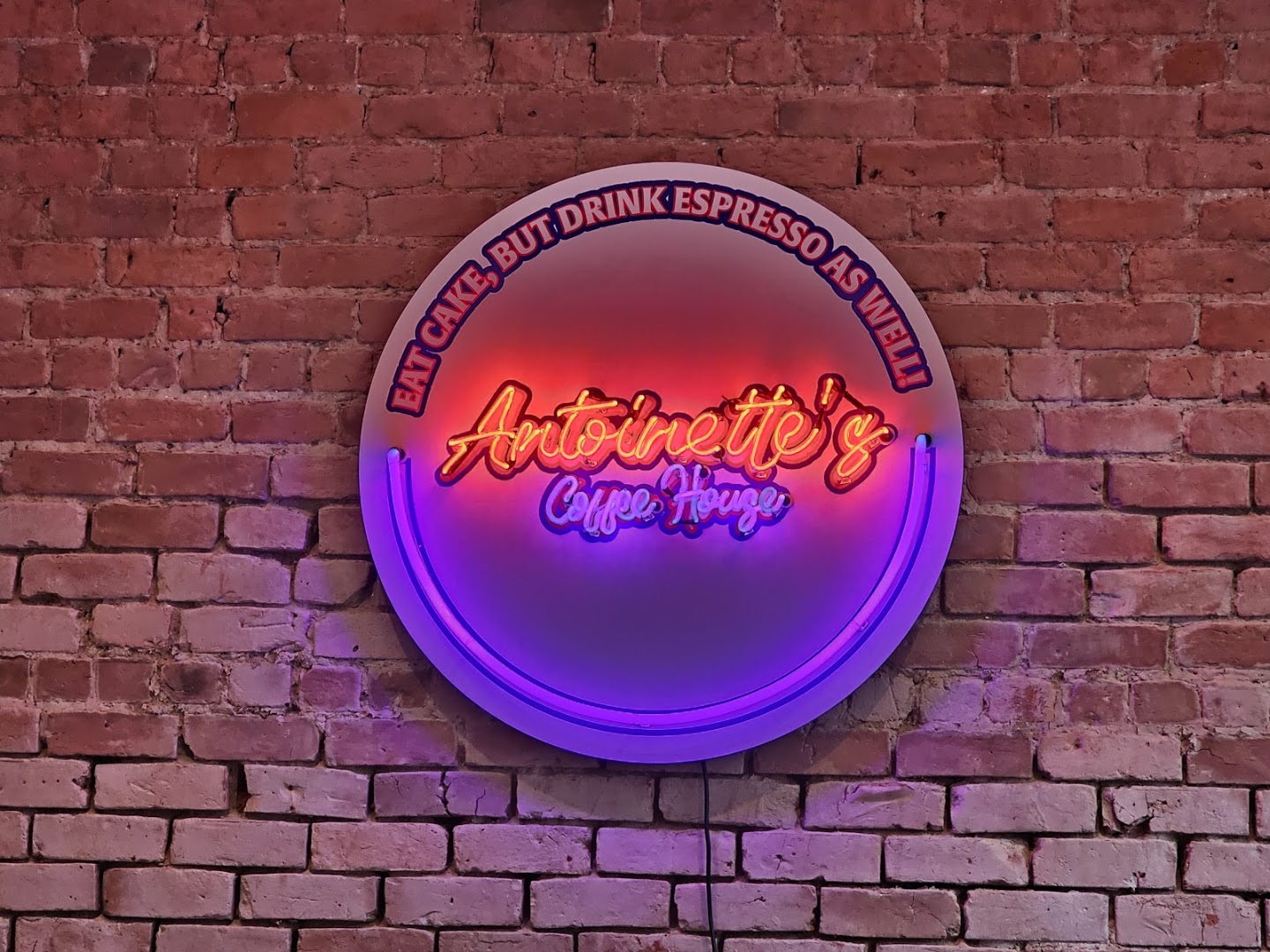 Antoinette's: attractive neon signage interior shot