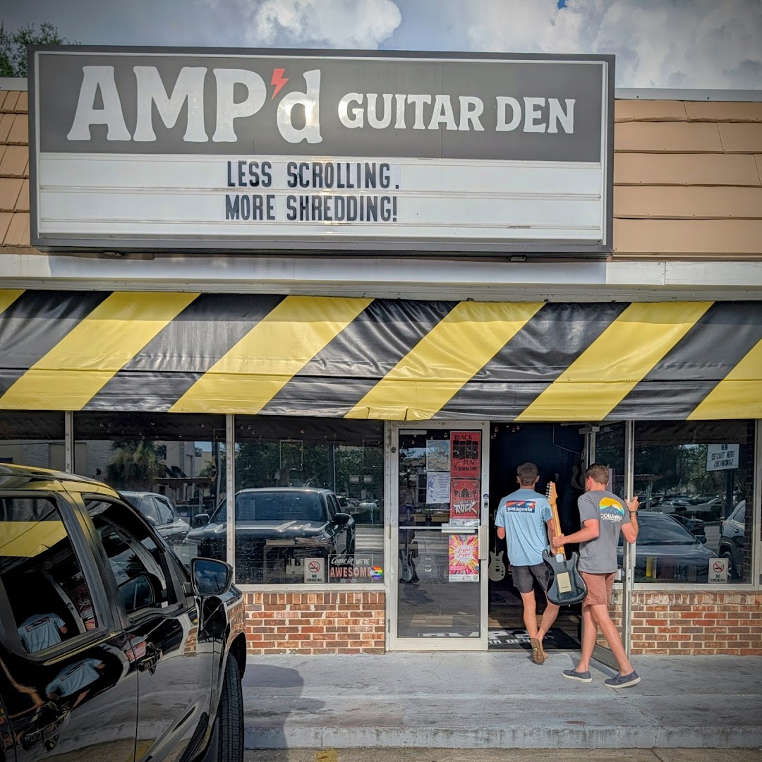 AMP'd Guitar Den: clear storefront showing shop entrance