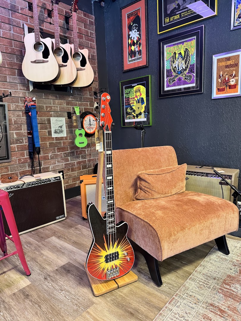 AMP'd Guitar Den: shop interior and products