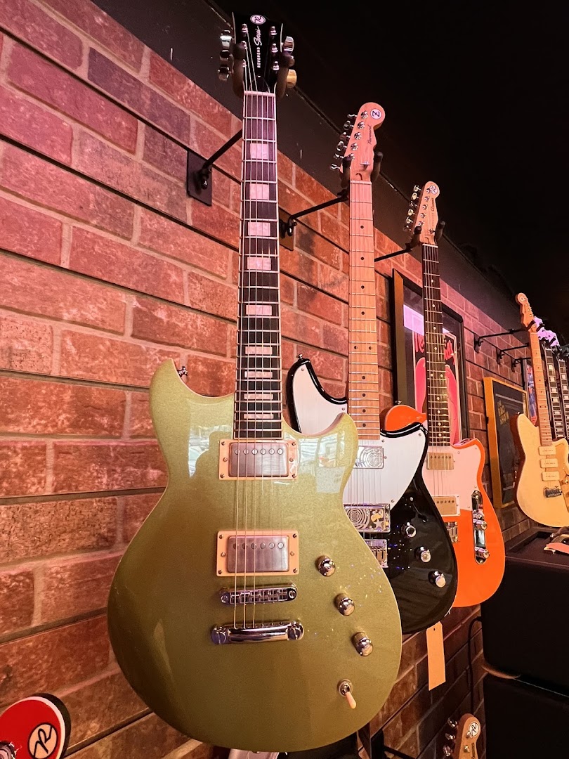 AMP'd Guitar Den: high quality product display photo