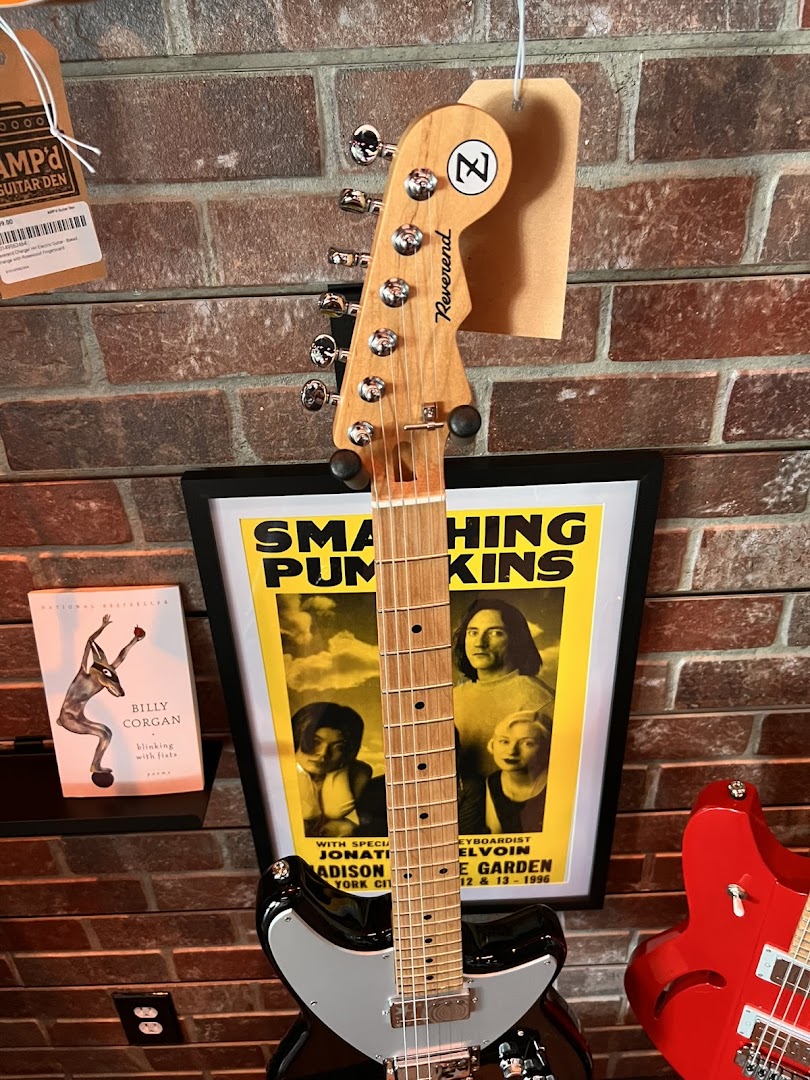 AMP'd Guitar Den: clear product display in shop