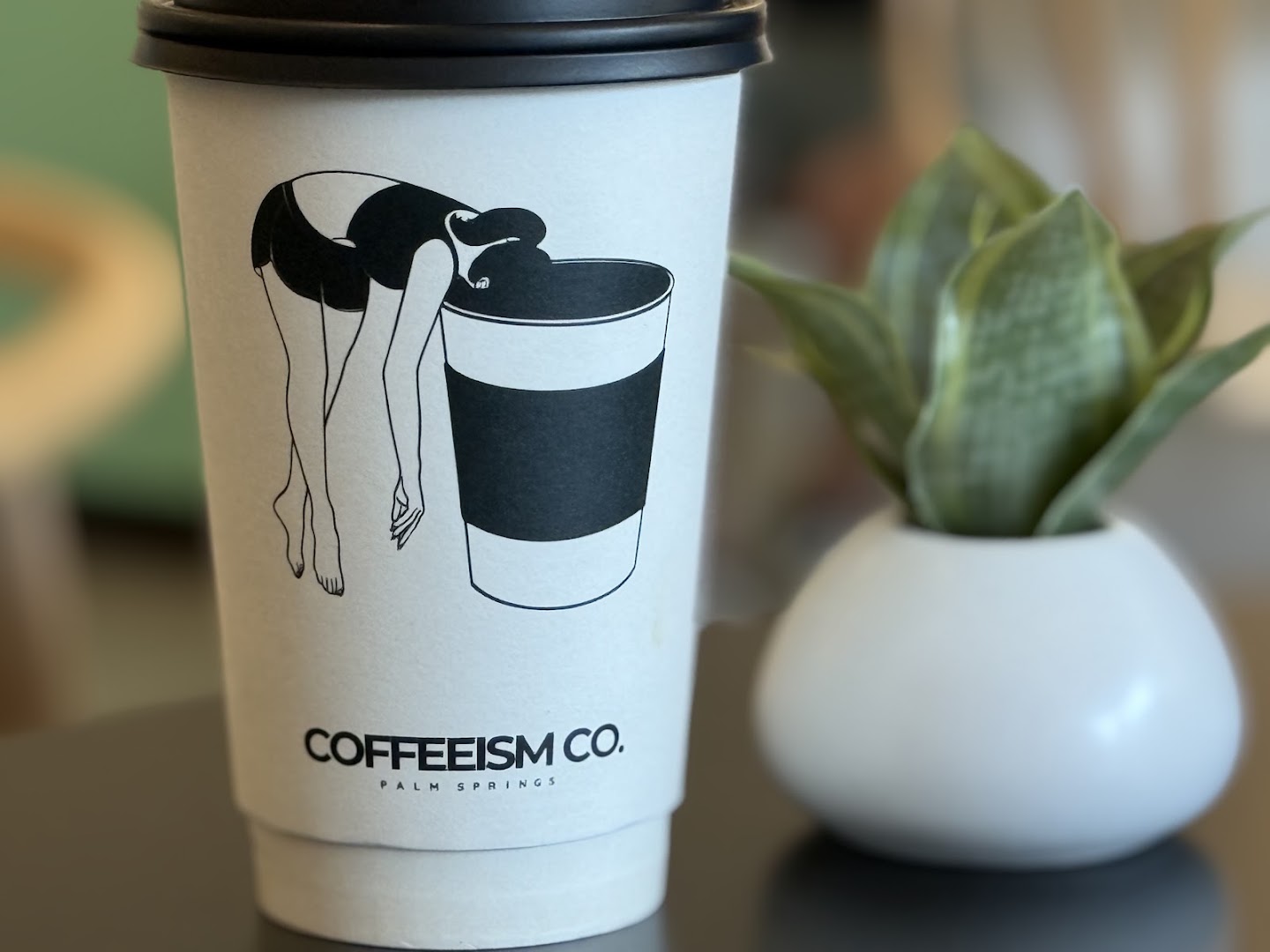 Coffeeism Co.: professional photo of branded cup
