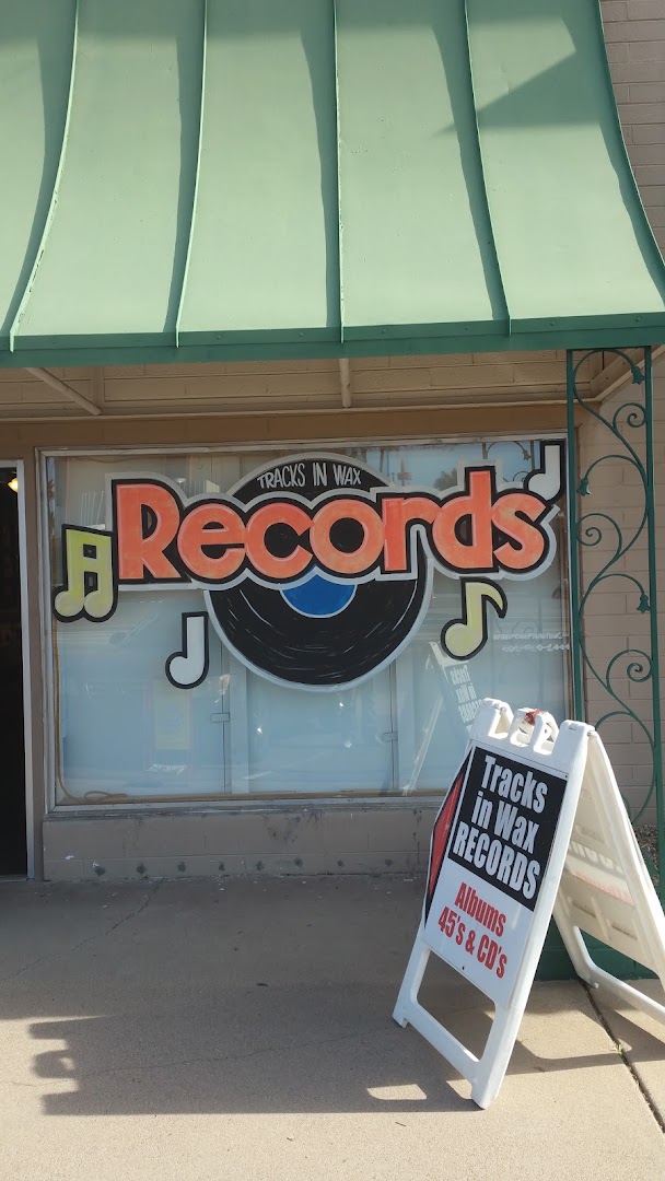 Tracks in Wax: clear storefront photo showing branding