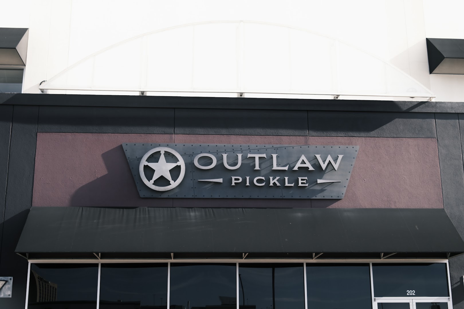 Outlaw Pickle: clear professional exterior signage photo