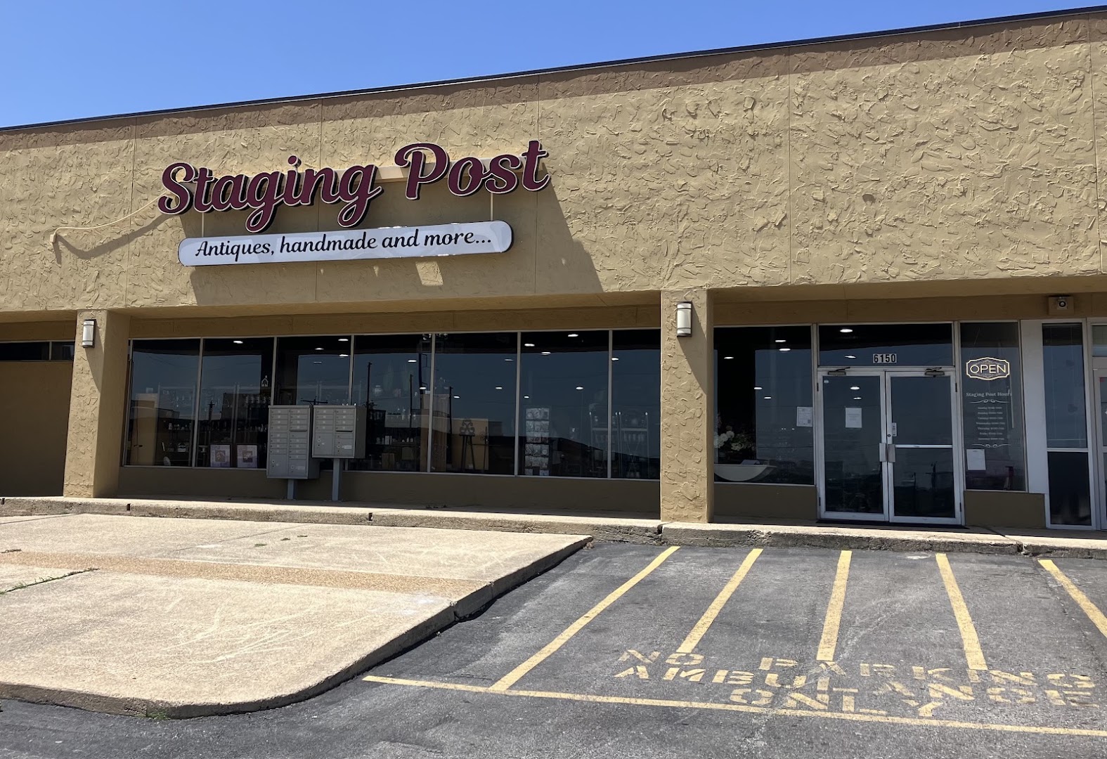 The Staging Post: clear storefront photo showing signage