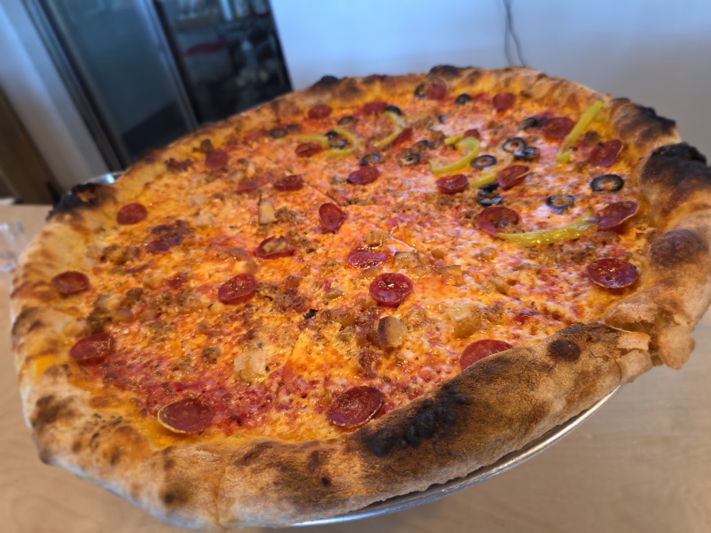Pizza Kaiju: appetizing photo of restaurant pizza