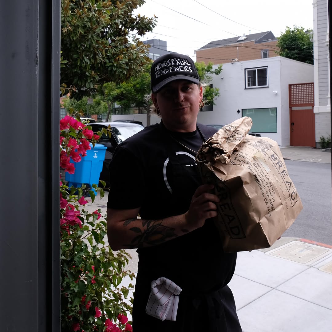 Side A: staff member with restaurant product