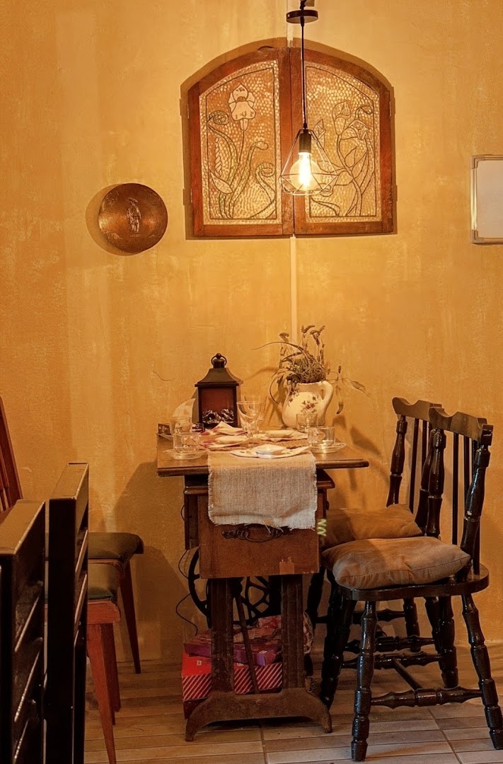 Chocolatería Explanada: inviting and atmospheric interior shot