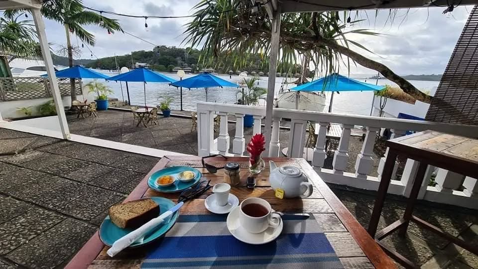Le Cafe du Village: inviting breakfast setting with view