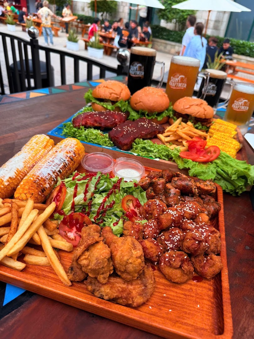 Tribal Grill - Ribs, Burger & Beer: appetizing food and drinks displayed